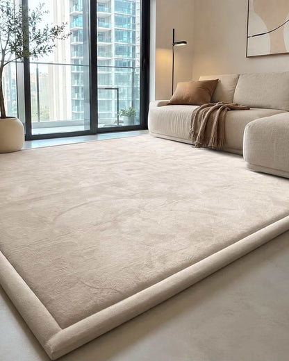Beige Misk Mat memory foam mat in a bright living room with floor-to-ceiling windows overlooking the city skyline.