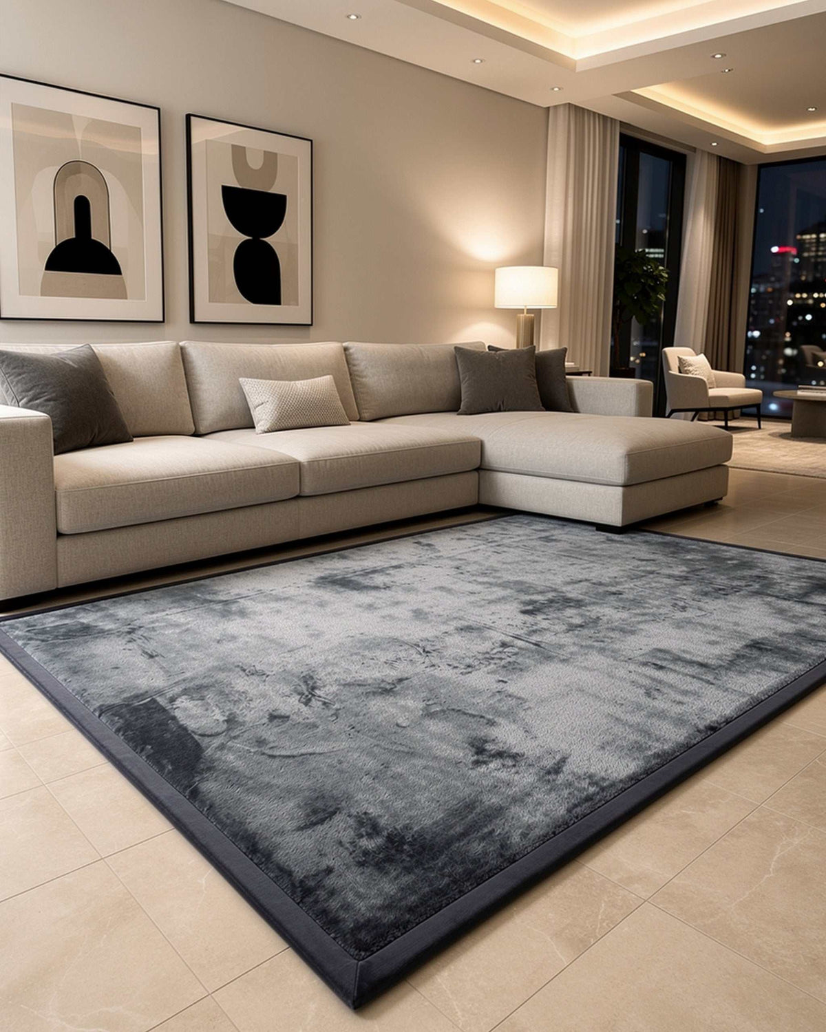 Dark Grey Misk Mat 35mm memory foam mat in an upscale living room with a beige sectional sofa and city skyline view at night.
