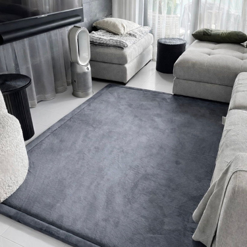 Dark grey memory foam carpet in a Dubai room