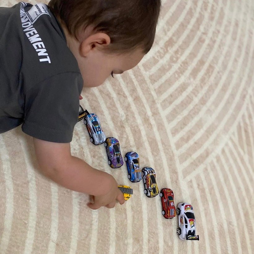 Ivory Arches patterned memory foam mat with a kid playing with his cars on it