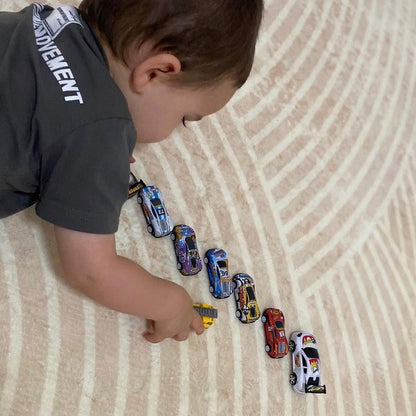 Ivory Arches patterned memory foam mat with a kid playing with his cars on it